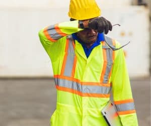 Worker wiping brow