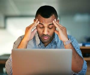 stressed office worker at computer